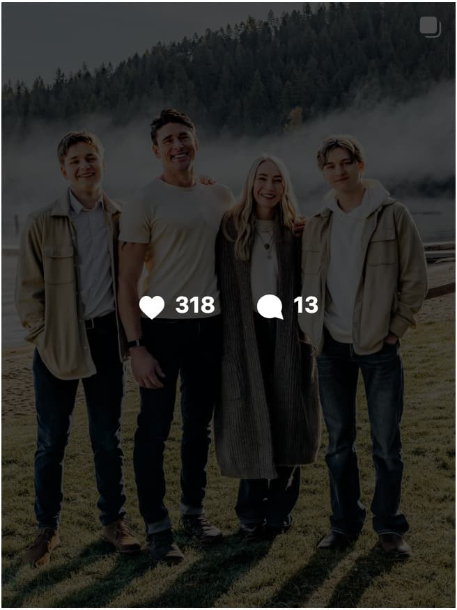 Ben Greenfield wearing a black hoodie with arms crossed, looking off to the side against a blurred outdoor background of trees and overcast sky.