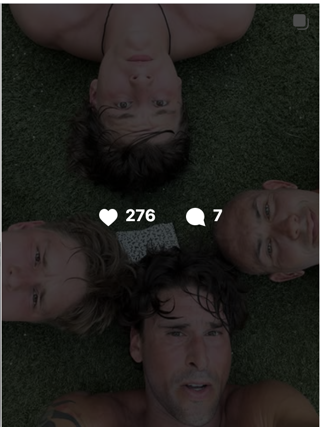 Instagram thumbnail of Ben Greenfield and his two teenage sons lying on the grass looking up at the camera, showing 276 likes and 7 comments