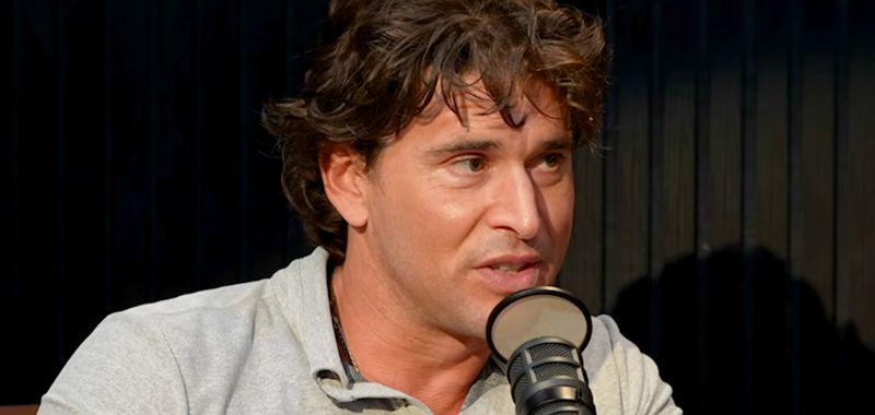 Ben Greenfield in front of mic in a grey polo