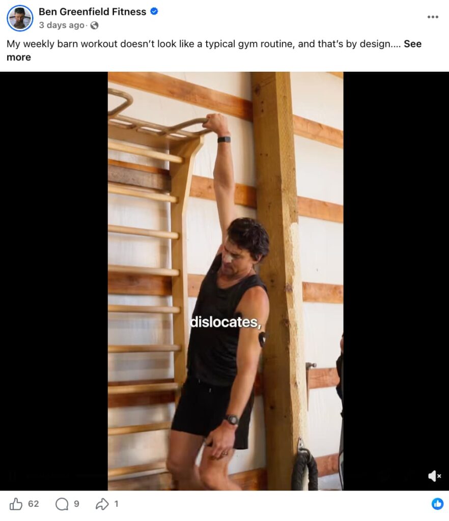 Facebook video post from Ben Greenfield Fitness captioned ‘My weekly barn workout doesn’t look like a typical gym routine, and that’s by design...’ The video shows Ben Greenfield, a man with dark hair wearing a black tank top and shorts, reaching up to grip a wooden ladder-style exercise rig inside a barn, with the caption text ‘dislocates,’ visible on screen.